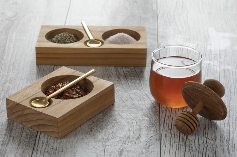Teak Cellar With Gold Spoon